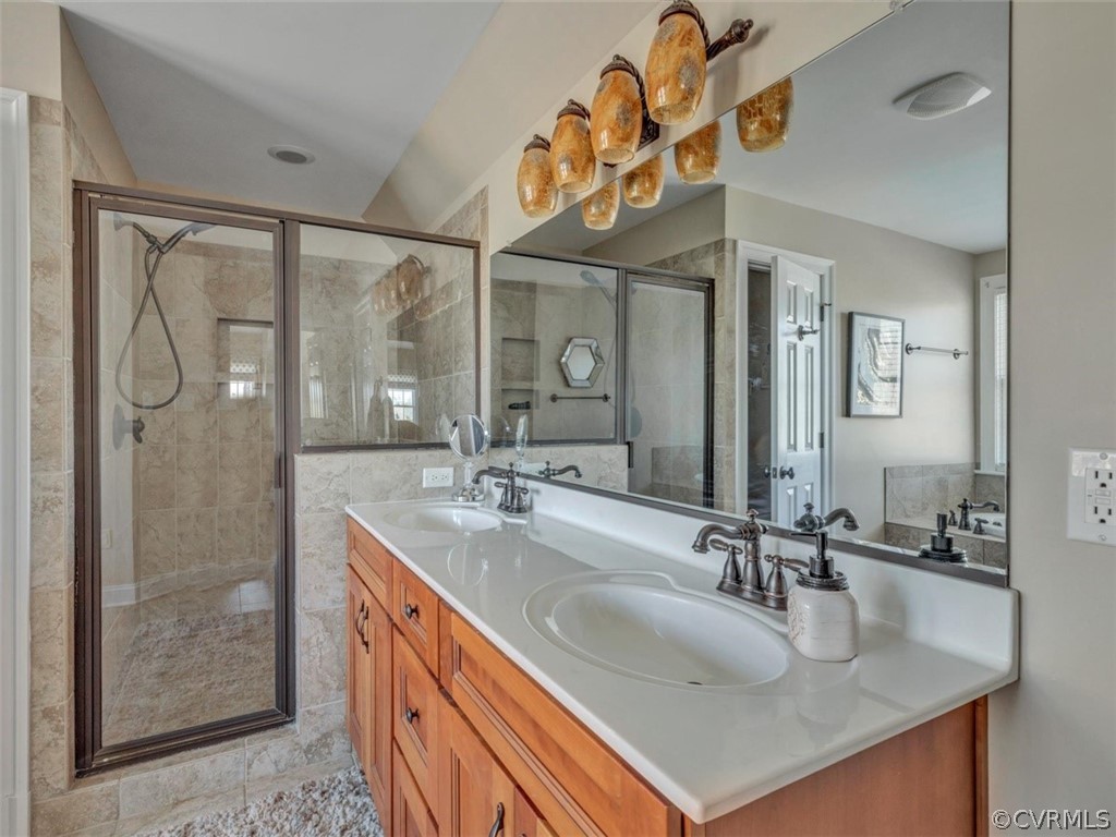 16001 Alsdell Road Midlothian, VA 23112 - Photo 33 of 44 a bathroom with a sink a vanity and a mirror