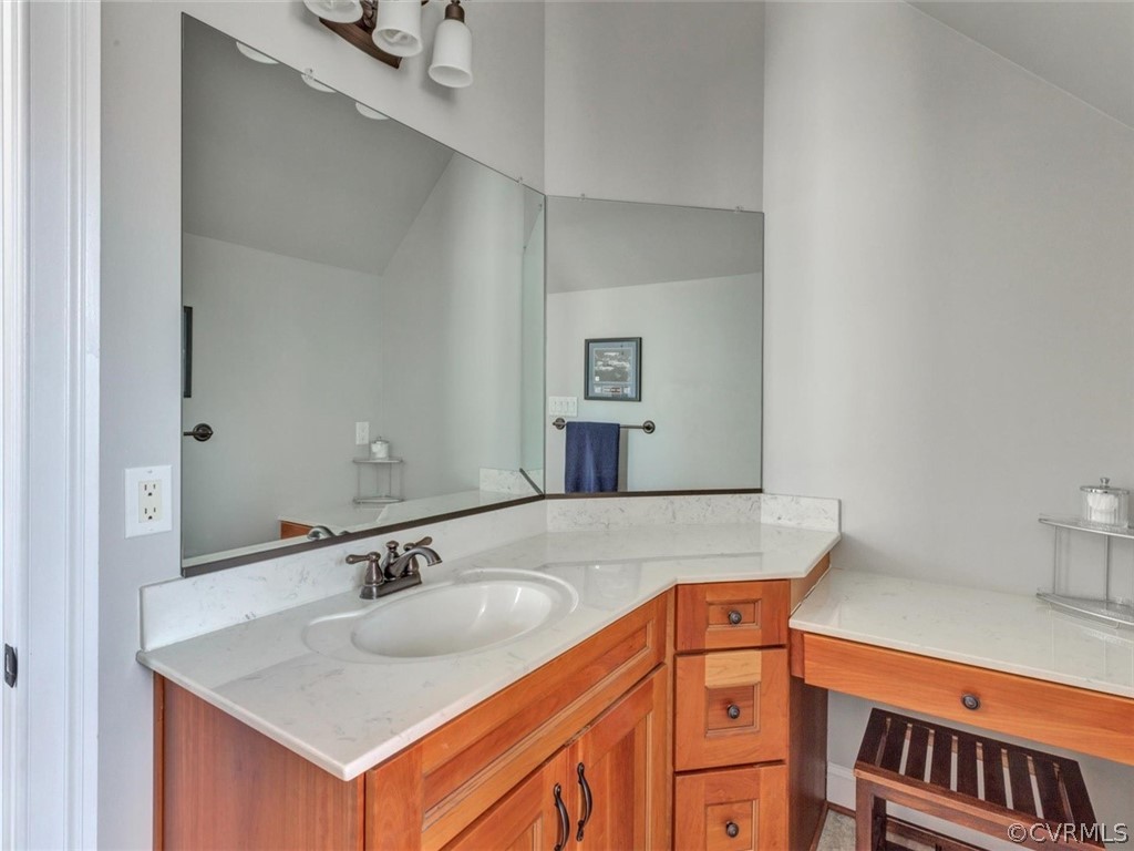 16001 Alsdell Road Midlothian, VA 23112 - Photo 39 of 44 a bathroom with a sink and a mirror