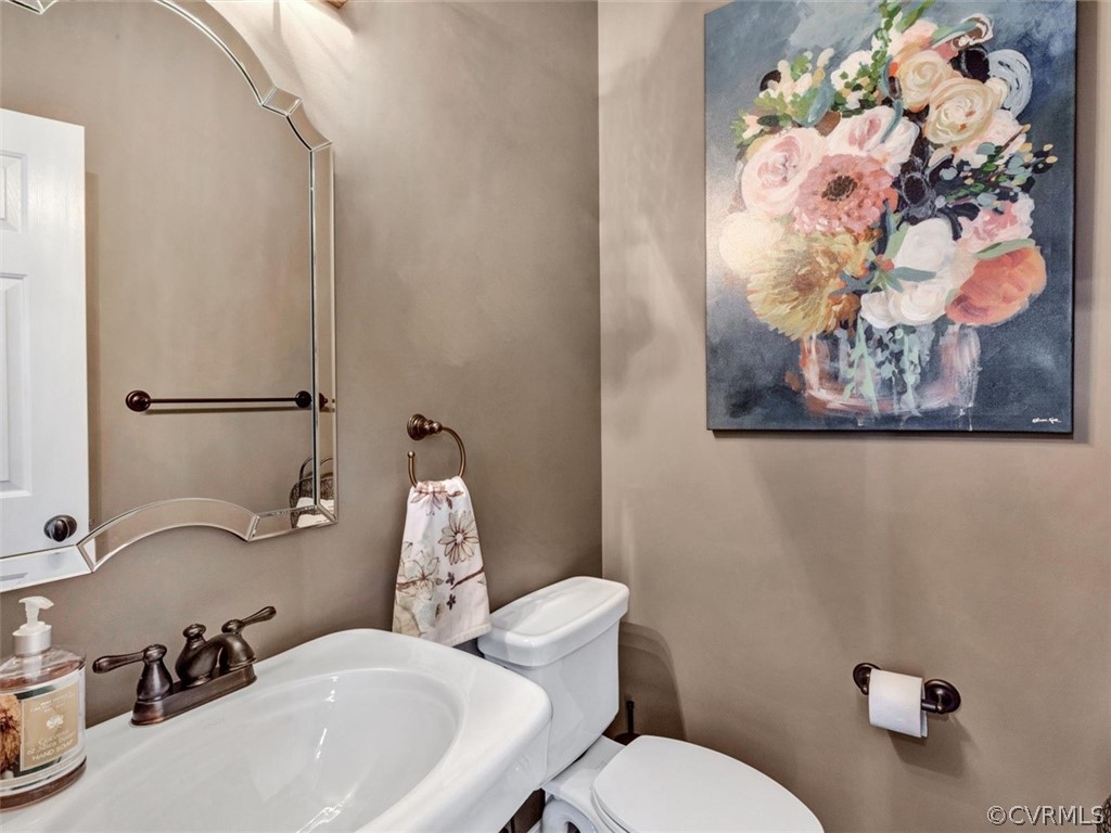 16001 Alsdell Road Midlothian, VA 23112 - Photo 7 of 44 a bathroom with a sink mirror and toilet
