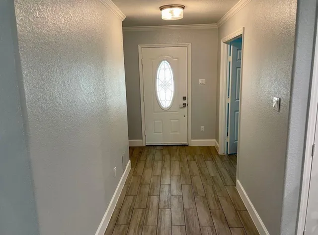 a view of a livingroom from a hallway