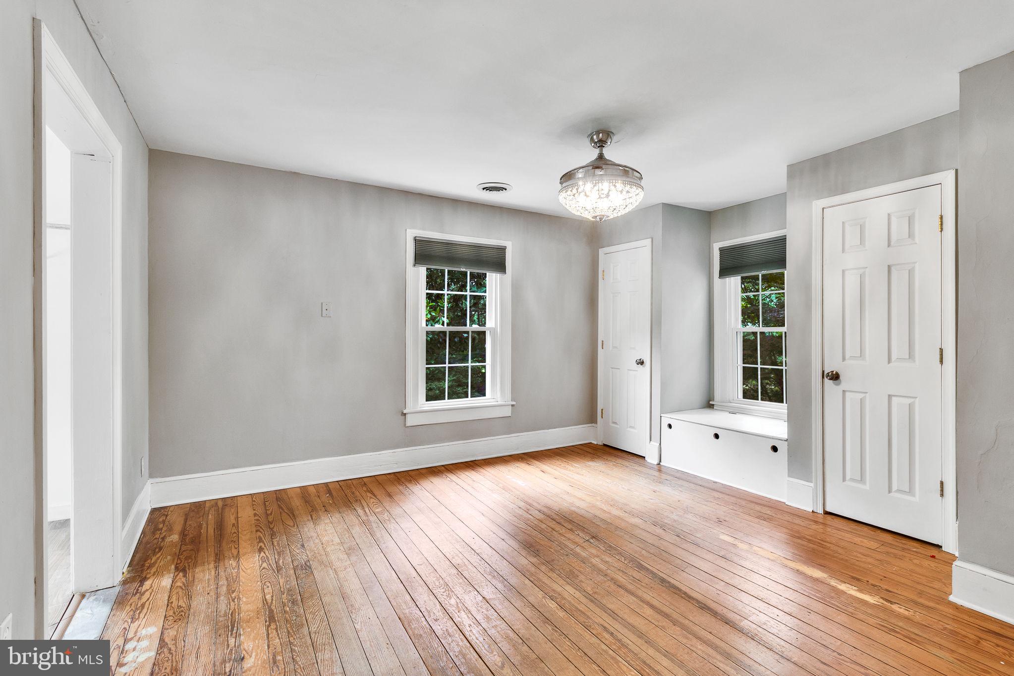 3952 Irvington Road Irvington, VA 22480 - Photo 29 of 77 wooden floor in an empty room with a window
