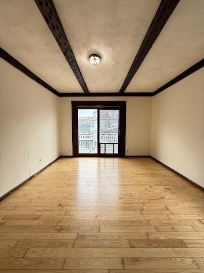 5 Alcott Street, Unit 2 Boston, MA 02134 - Photo 1 of 14 a view of an empty room with a window