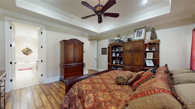 a bedroom with a bed and cabinets