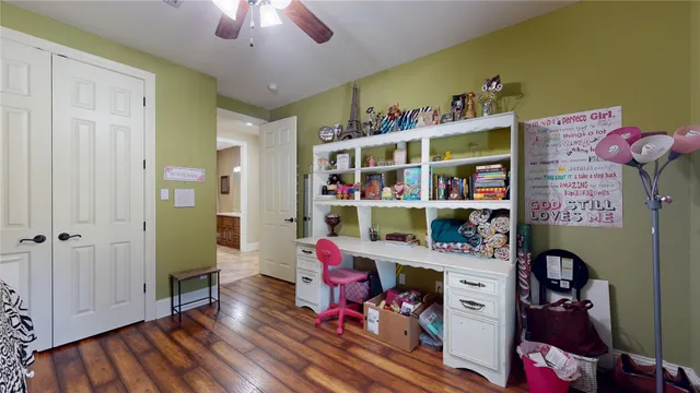 a living room with lots of furniture and wooden floor