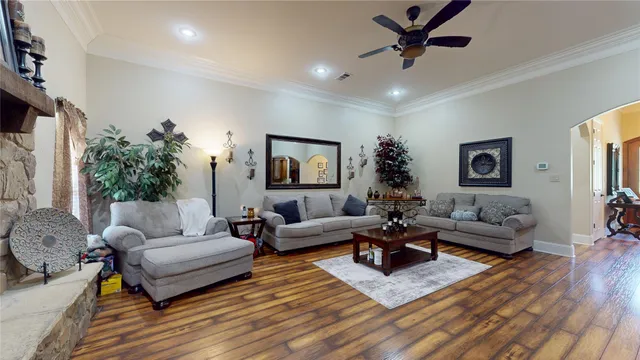 a living room with furniture or couch and a wooden floor