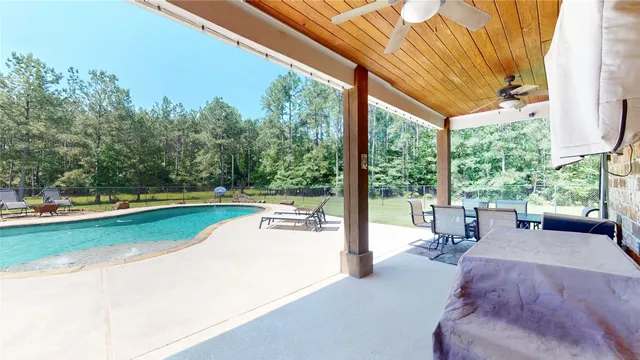 a view of a patio with swimming pool