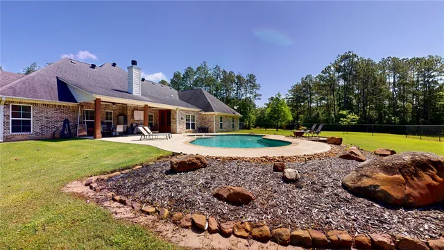 a view of a house with a swimming pool
