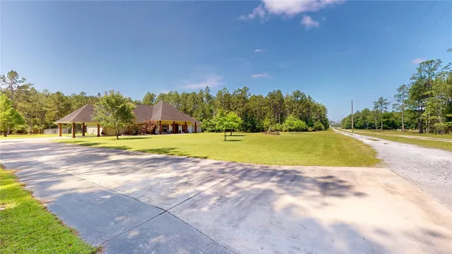 a view of a swimming pool and trees