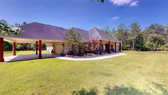 a view of house with swimming pool outdoor seating and city view
