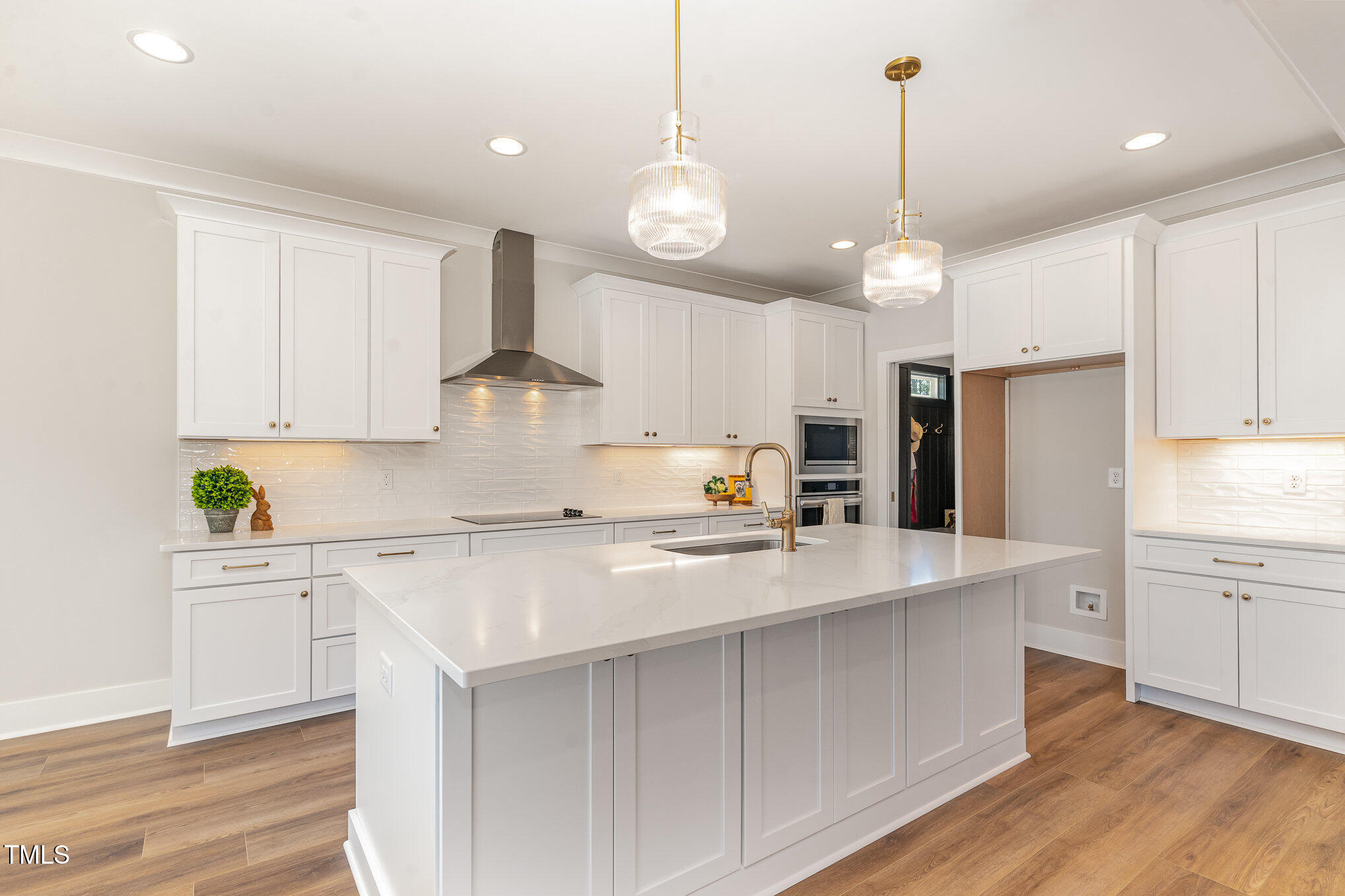 57 Nottoway Lane Wendell, NC 27591 - Photo 16 of 42 a kitchen with stainless steel appliances a stove center island refrigerator and cabinets