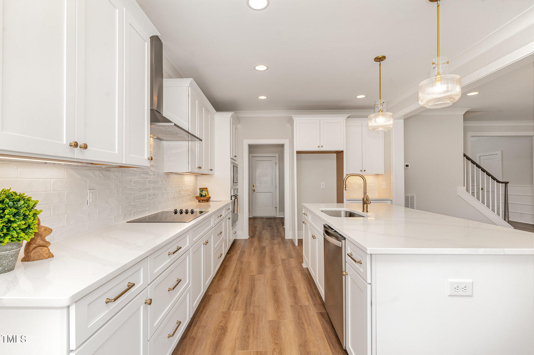 57 Nottoway Lane Wendell, NC 27591 - Photo 17 of 42 a large kitchen with kitchen island a large counter space a sink appliances and cabinets