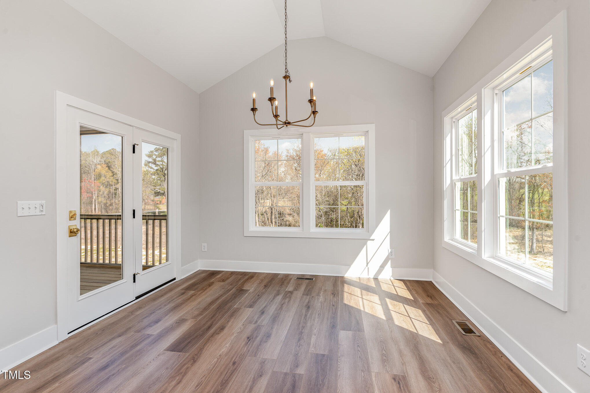 57 Nottoway Lane Wendell, NC 27591 - Photo 20 of 42 a view of an empty room with wooden floor and a window