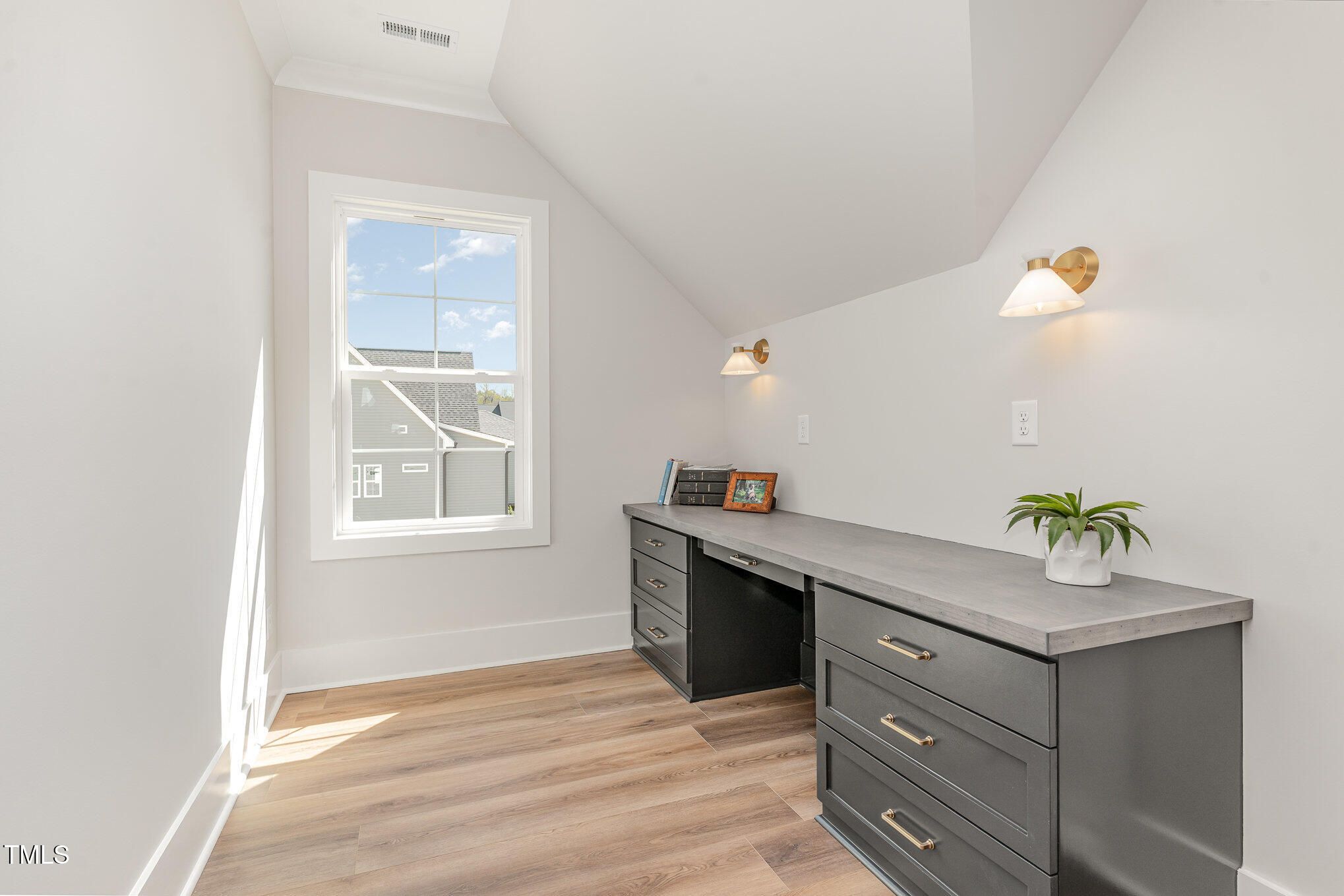 57 Nottoway Lane Wendell, NC 27591 - Photo 23 of 42 a room with painting on the wall and a window