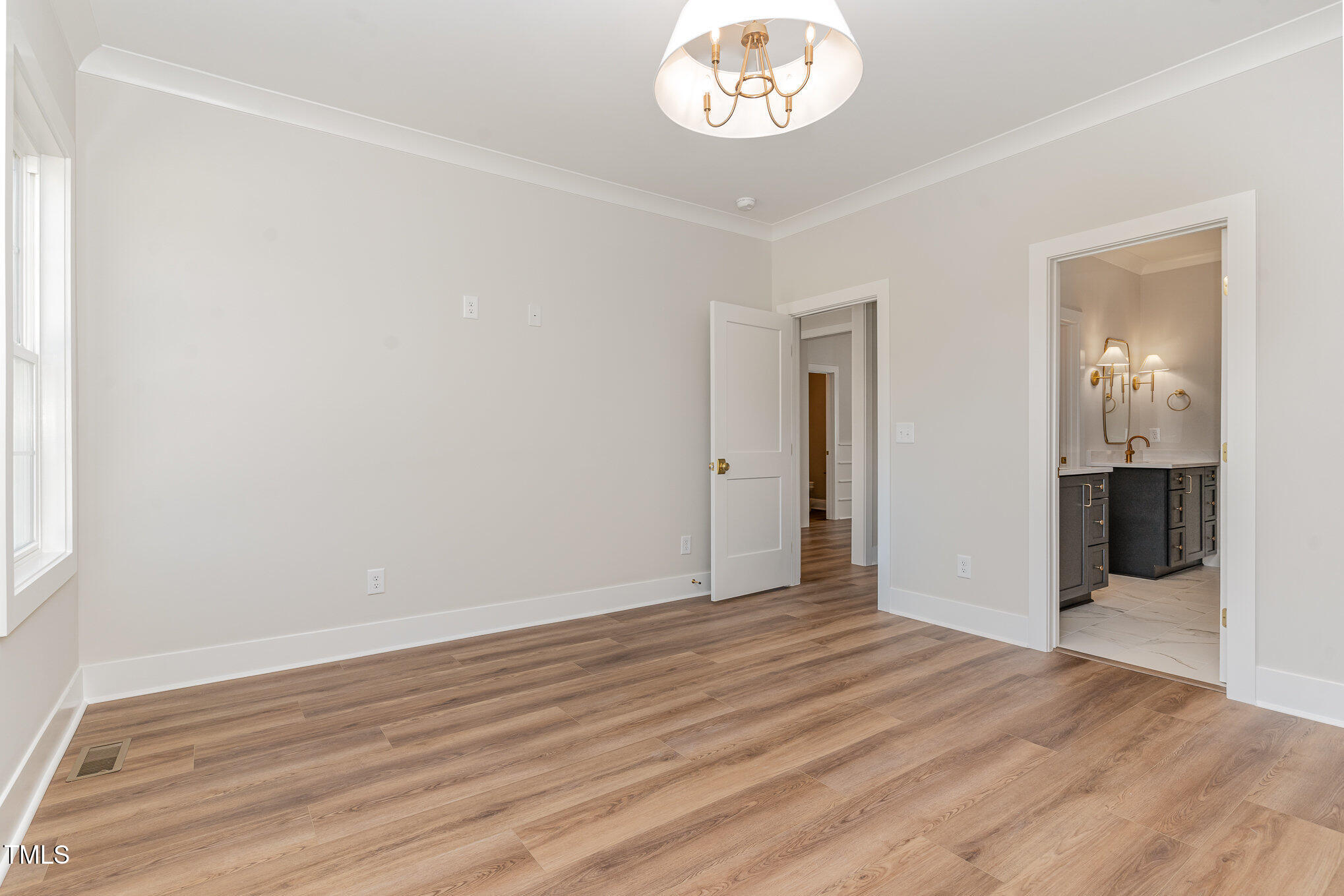 57 Nottoway Lane Wendell, NC 27591 - Photo 25 of 42 an empty room with wooden floor and a hallway