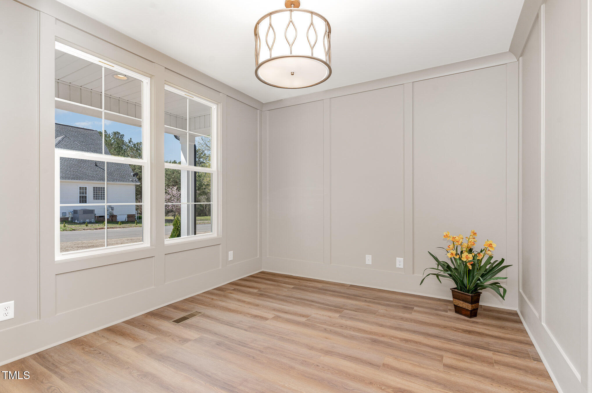 57 Nottoway Lane Wendell, NC 27591 - Photo 29 of 42 a view of an empty room with a window and wooden floor