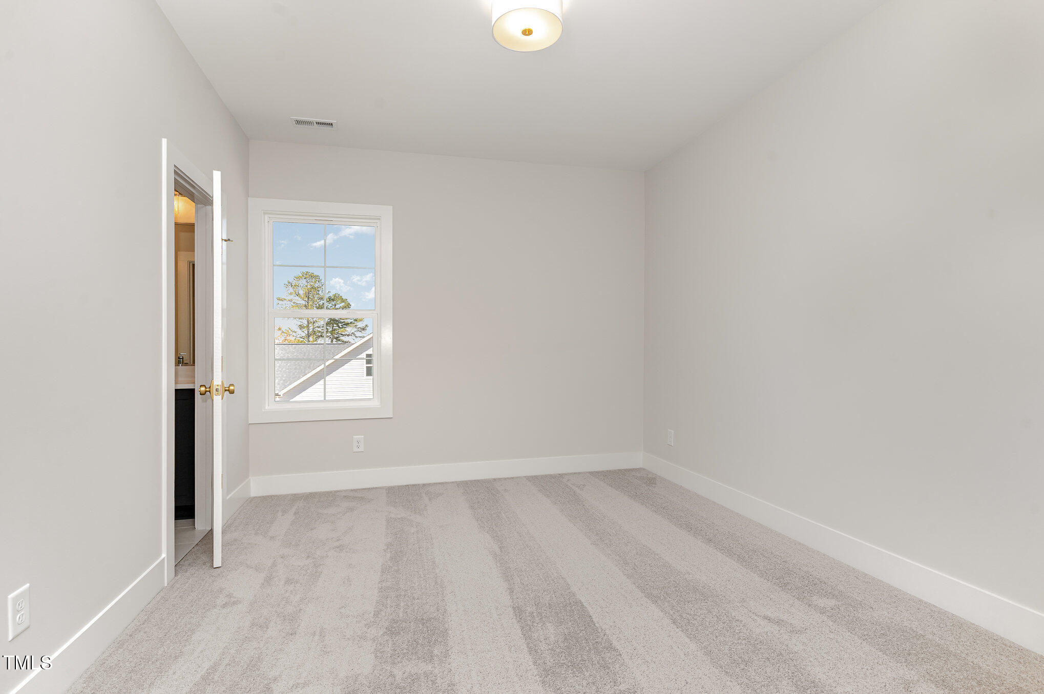 57 Nottoway Lane Wendell, NC 27591 - Photo 30 of 42 an empty room with a window