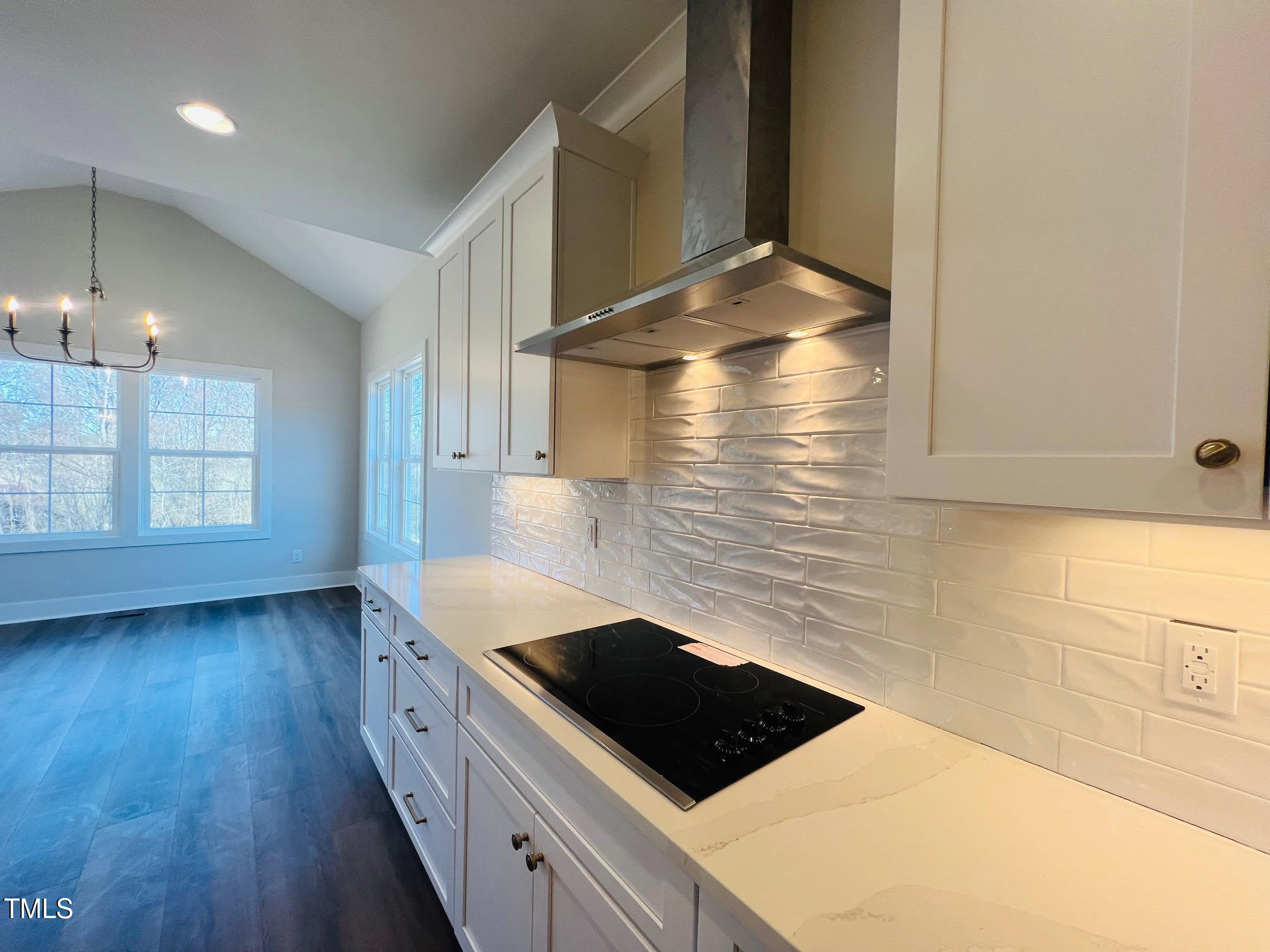57 Nottoway Lane Wendell, NC 27591 - Photo 37 of 42 a kitchen with granite countertop a stove a sink and a microwave