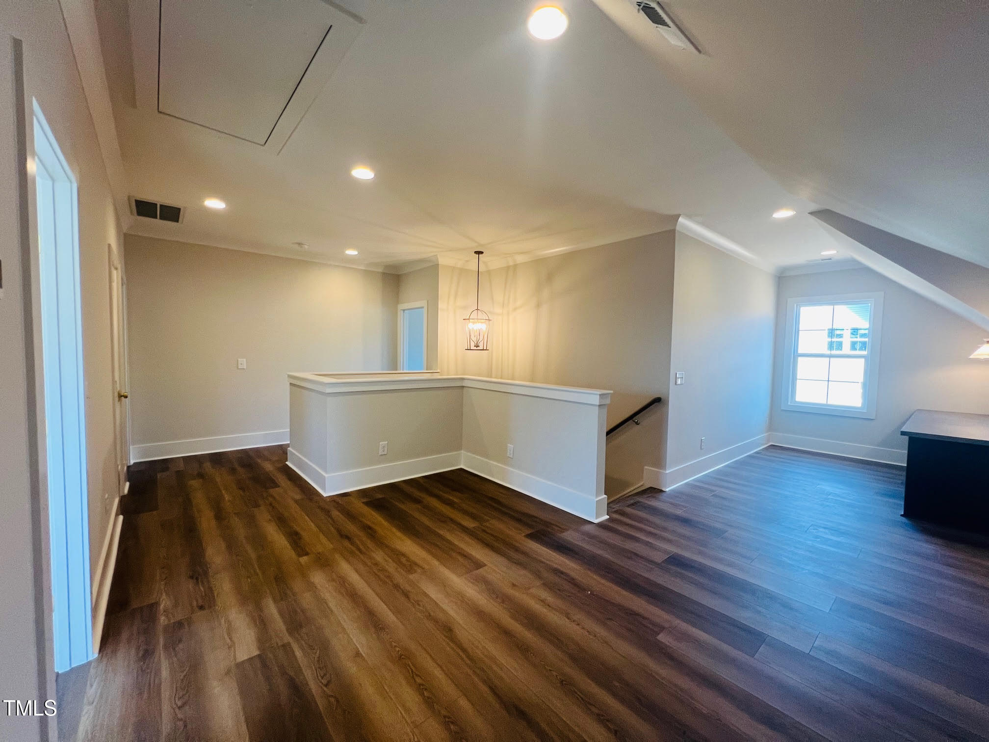57 Nottoway Lane Wendell, NC 27591 - Photo 38 of 42 a view of an empty room with wooden floor and a window