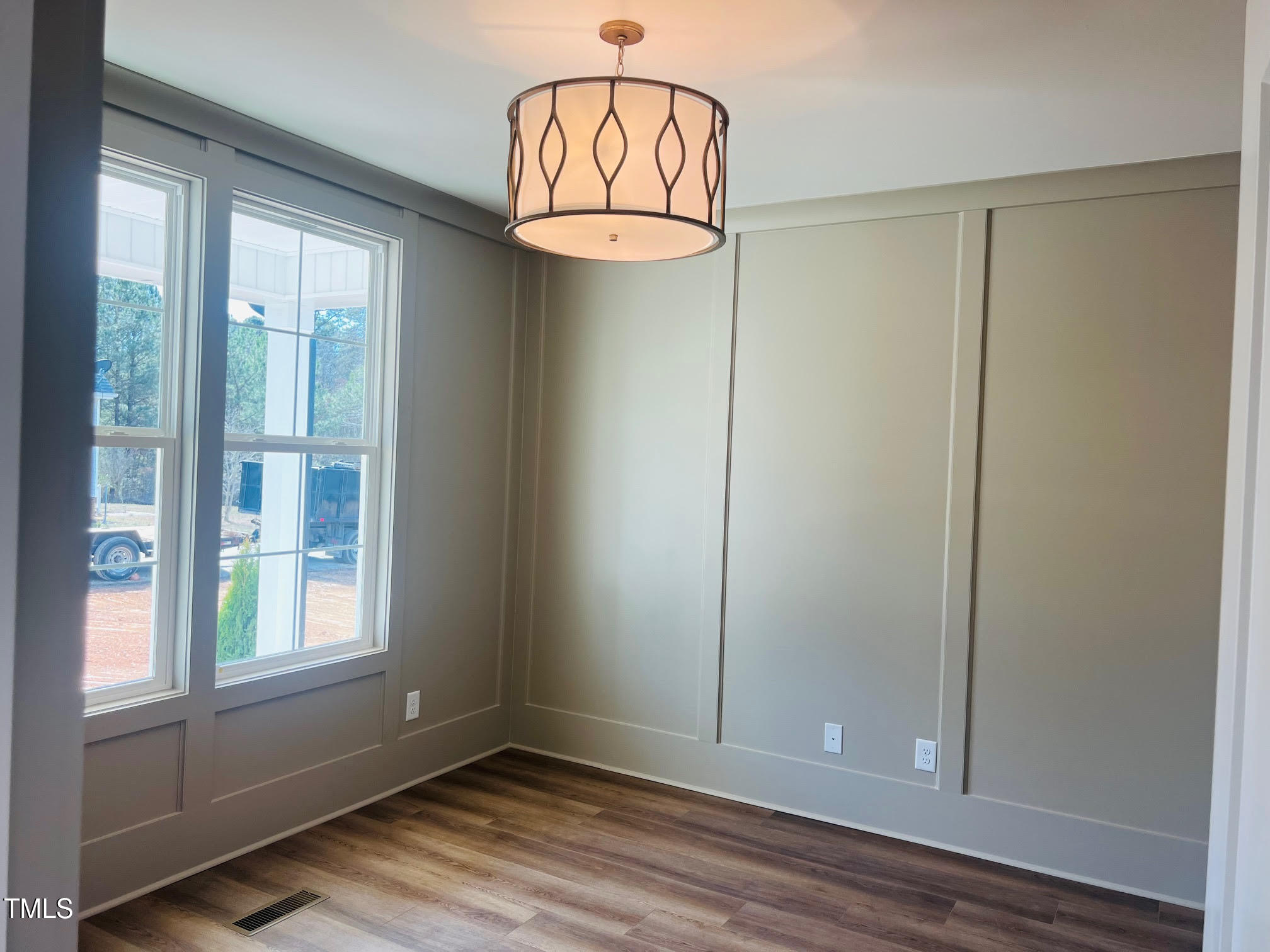 57 Nottoway Lane Wendell, NC 27591 - Photo 39 of 42 an empty room with wooden floor fan and windows