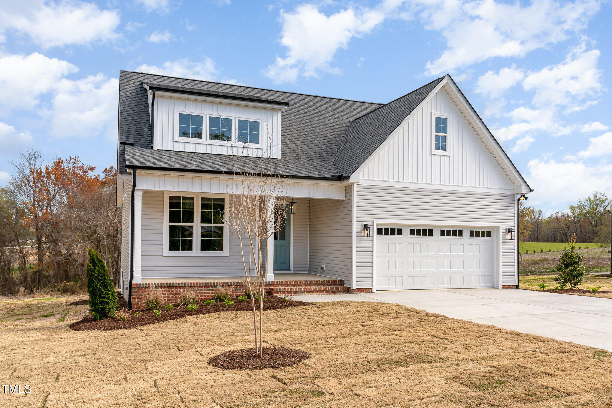 57 Nottoway Lane Wendell, NC 27591 - Photo 4 of 42 a front view of a house with a yard and garage