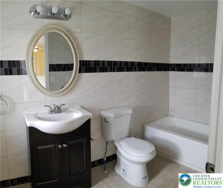 102 East Susquehanna Street, Unit 2 Allentown, PA 18103 - Photo 10 of 10 a bathroom with a sink and a mirror