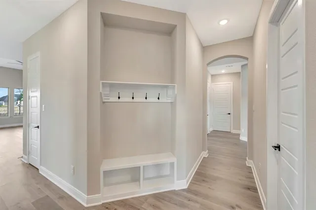 a kitchen with granite countertop a stove a sink dishwasher and a refrigerator