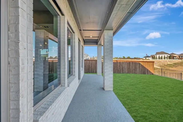 a view of balcony with floor to ceiling window and outdoor view