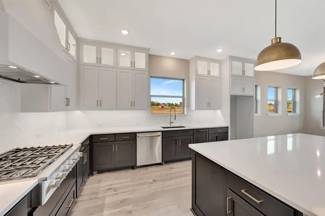 a view of a kitchen with granite countertop lots of counter top space