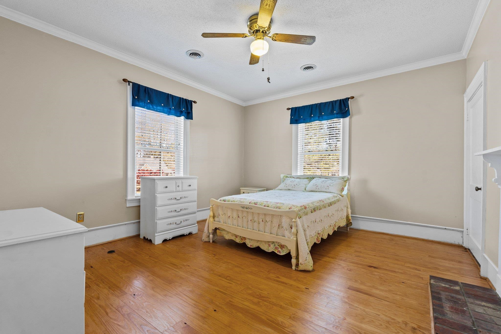 407 Old Post Road Erwin, NC 28339 - Photo 11 of 44 a bedroom with a bed and a ceiling fan
