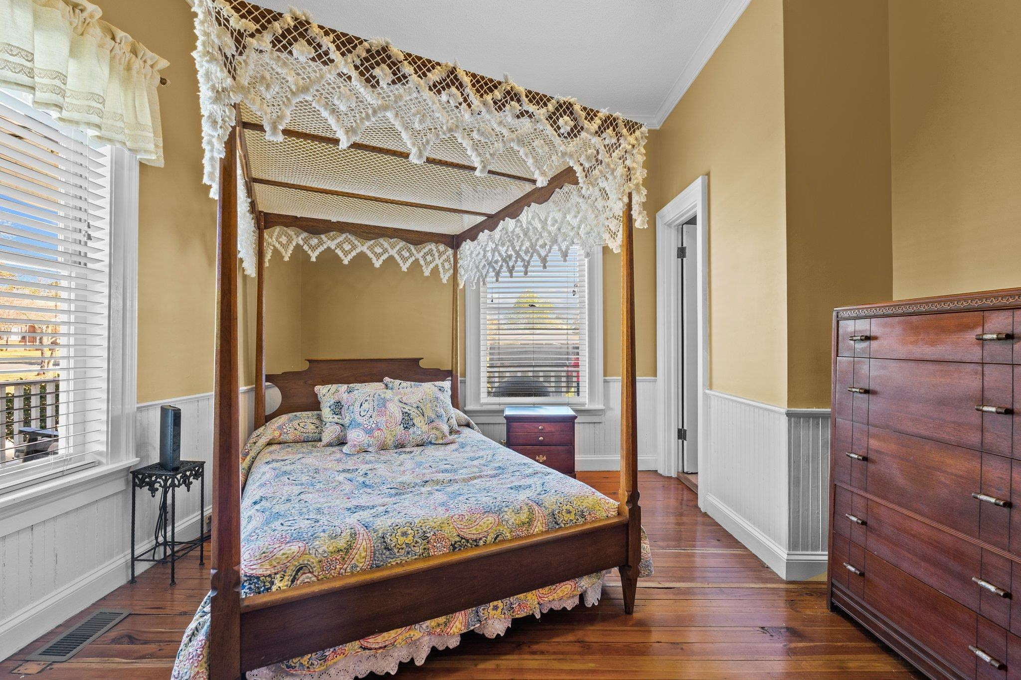 407 Old Post Road Erwin, NC 28339 - Photo 12 of 44 a bedroom with a large bed and a dresser