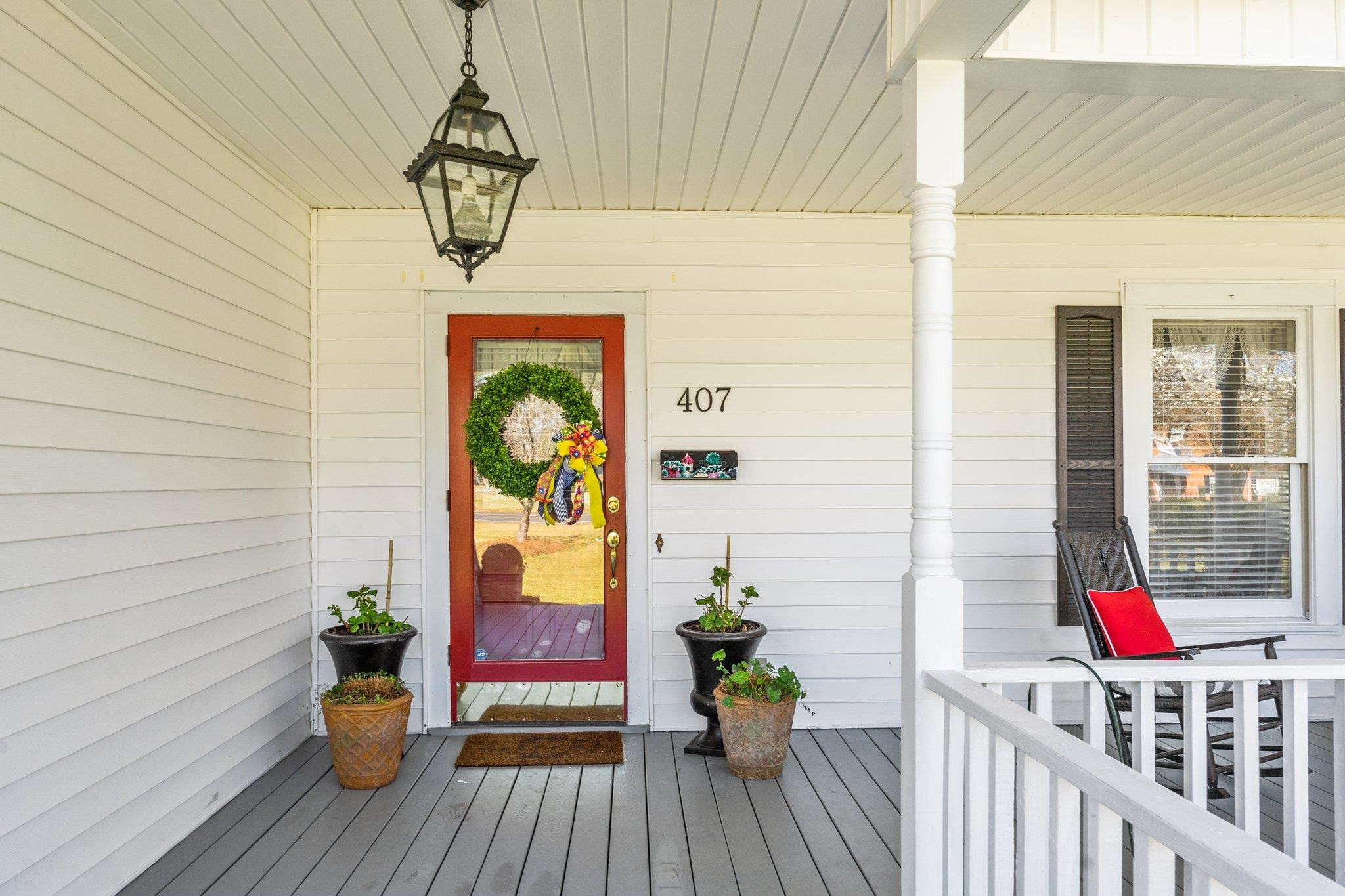 407 Old Post Road Erwin, NC 28339 - Photo 13 of 44 a view of a balcony with potted plants