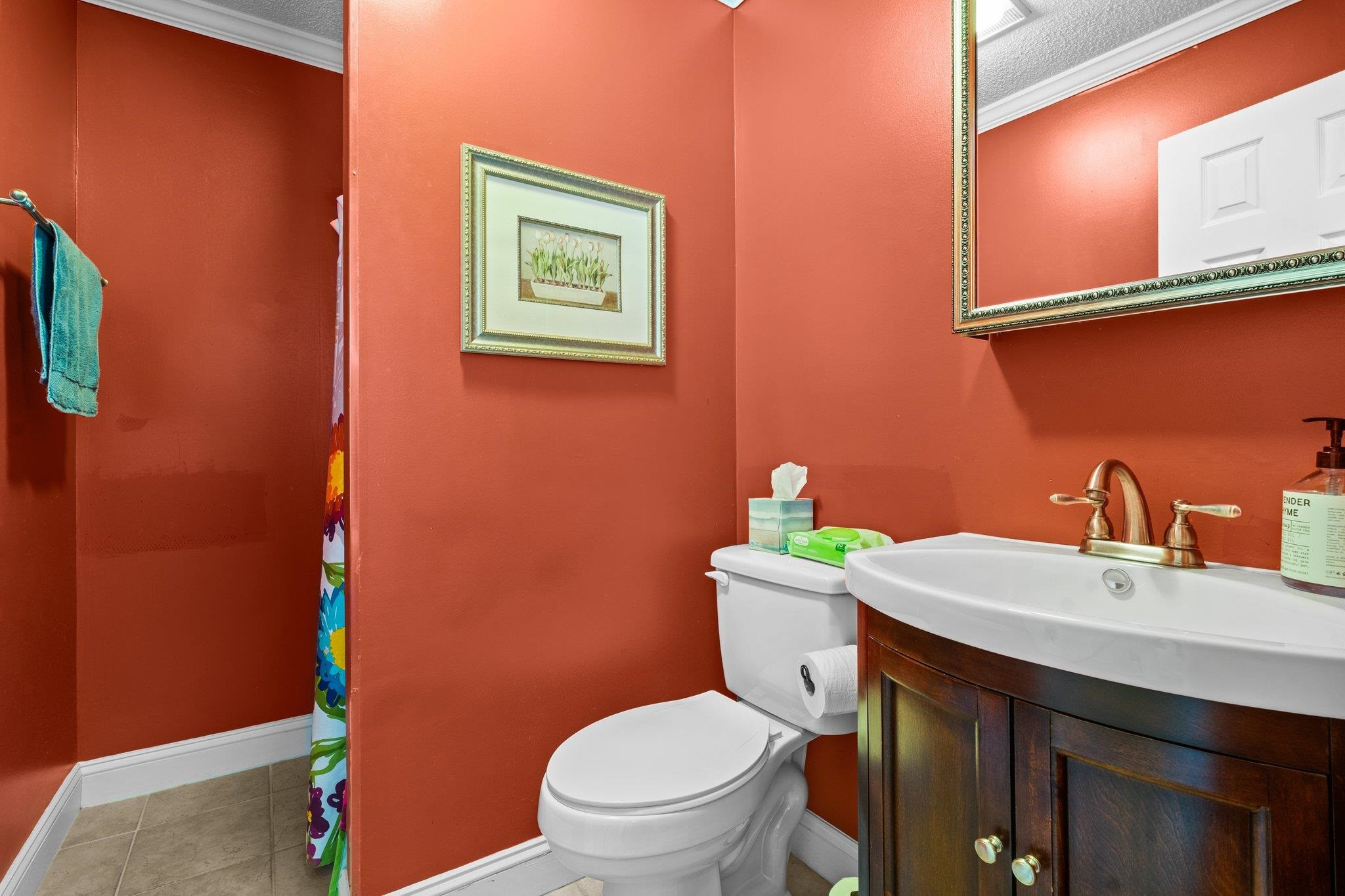 407 Old Post Road Erwin, NC 28339 - Photo 15 of 44 a bathroom with a sink a toilet and mirror