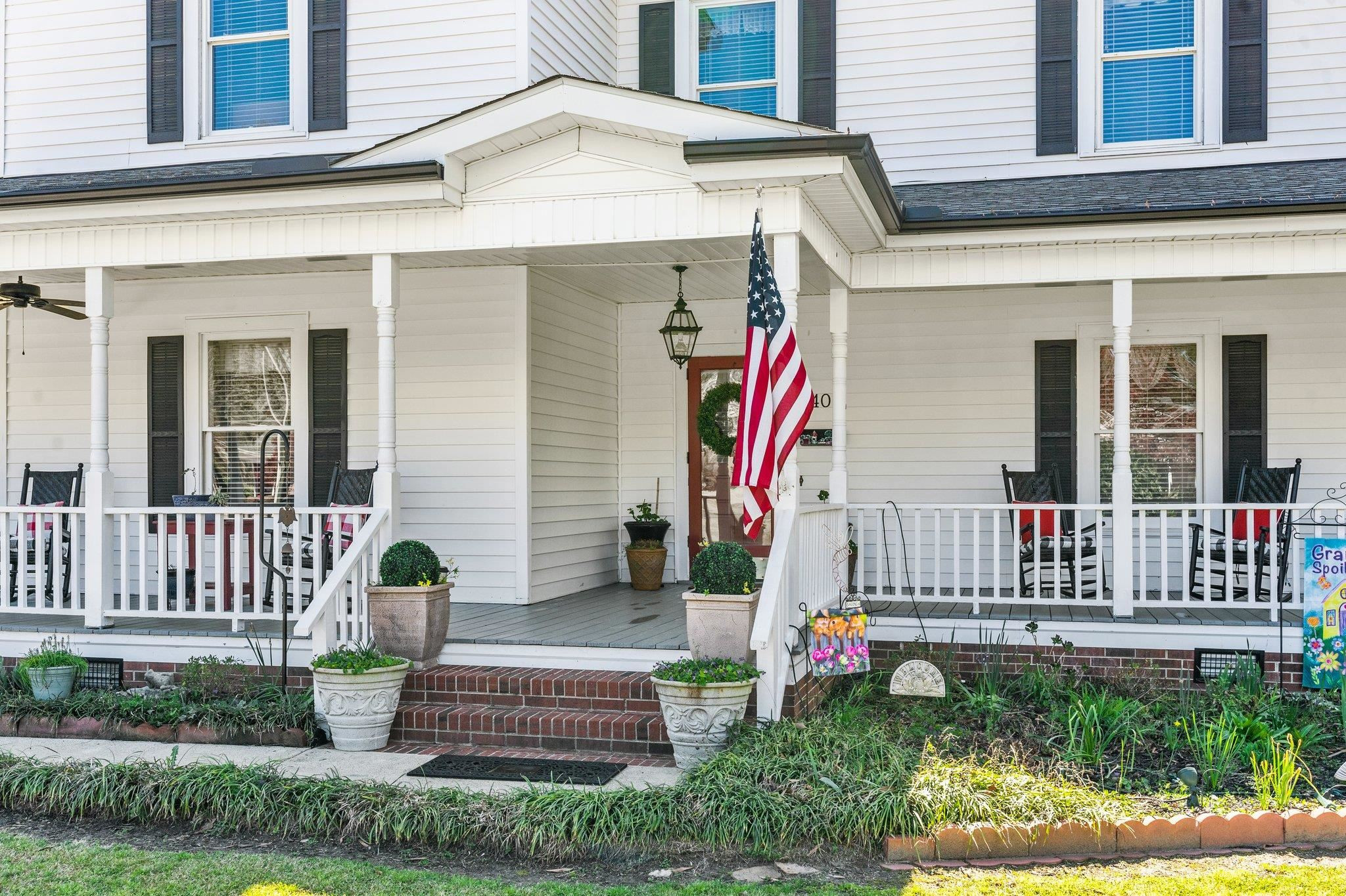 407 Old Post Road Erwin, NC 28339 - Photo 2 of 44 a front view of a house with garden and plants