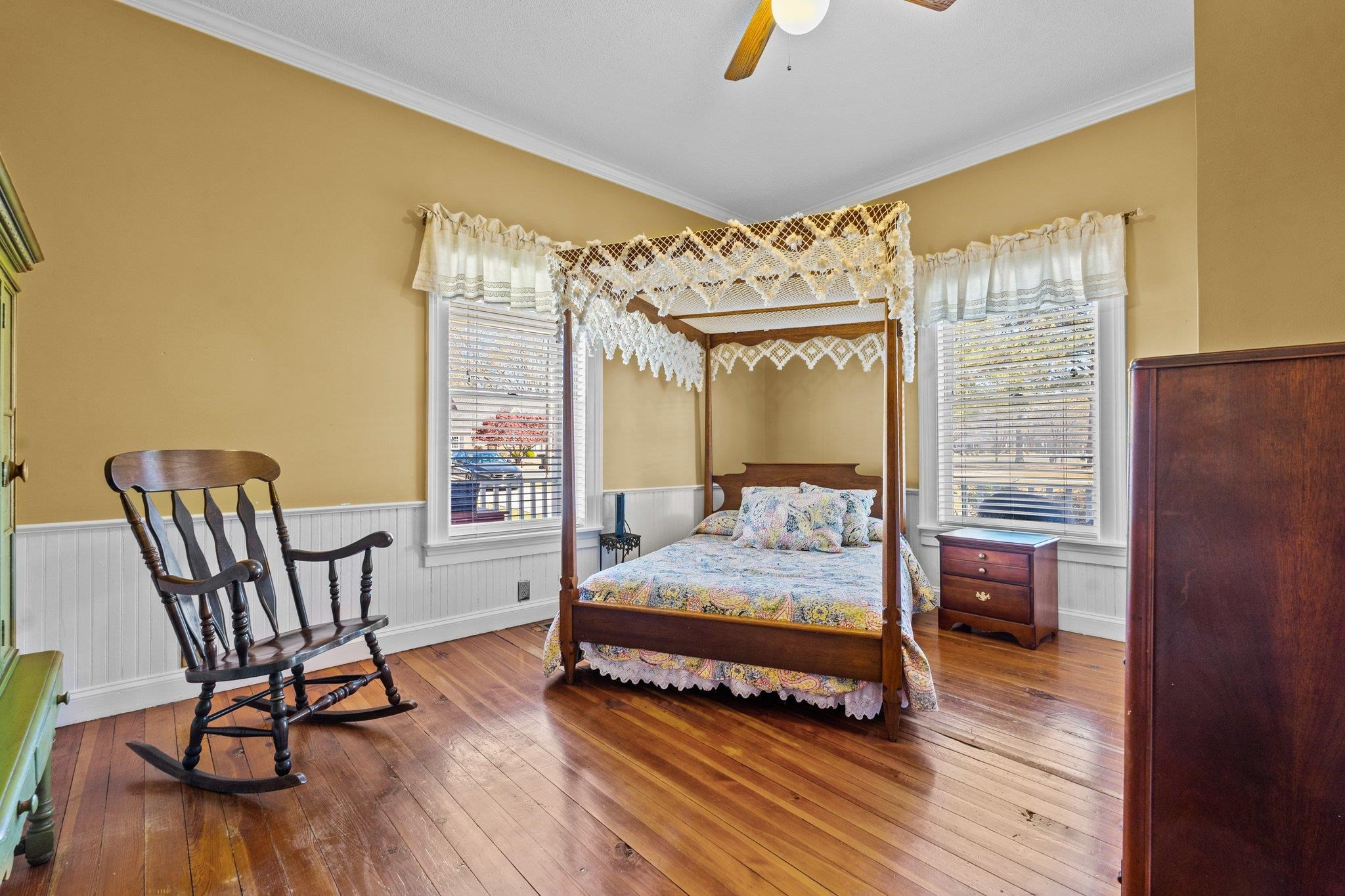 407 Old Post Road Erwin, NC 28339 - Photo 22 of 44 a bedroom with a bed and wooden floor