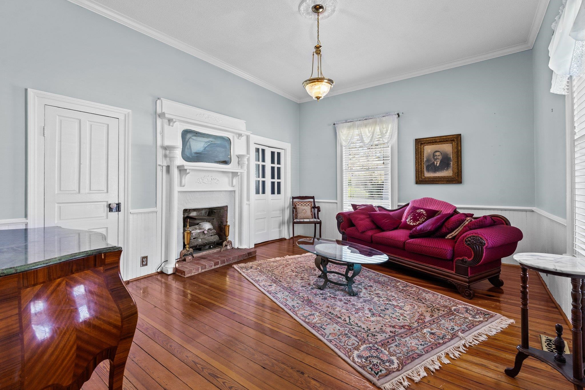 407 Old Post Road Erwin, NC 28339 - Photo 23 of 44 a living room with furniture and a fireplace