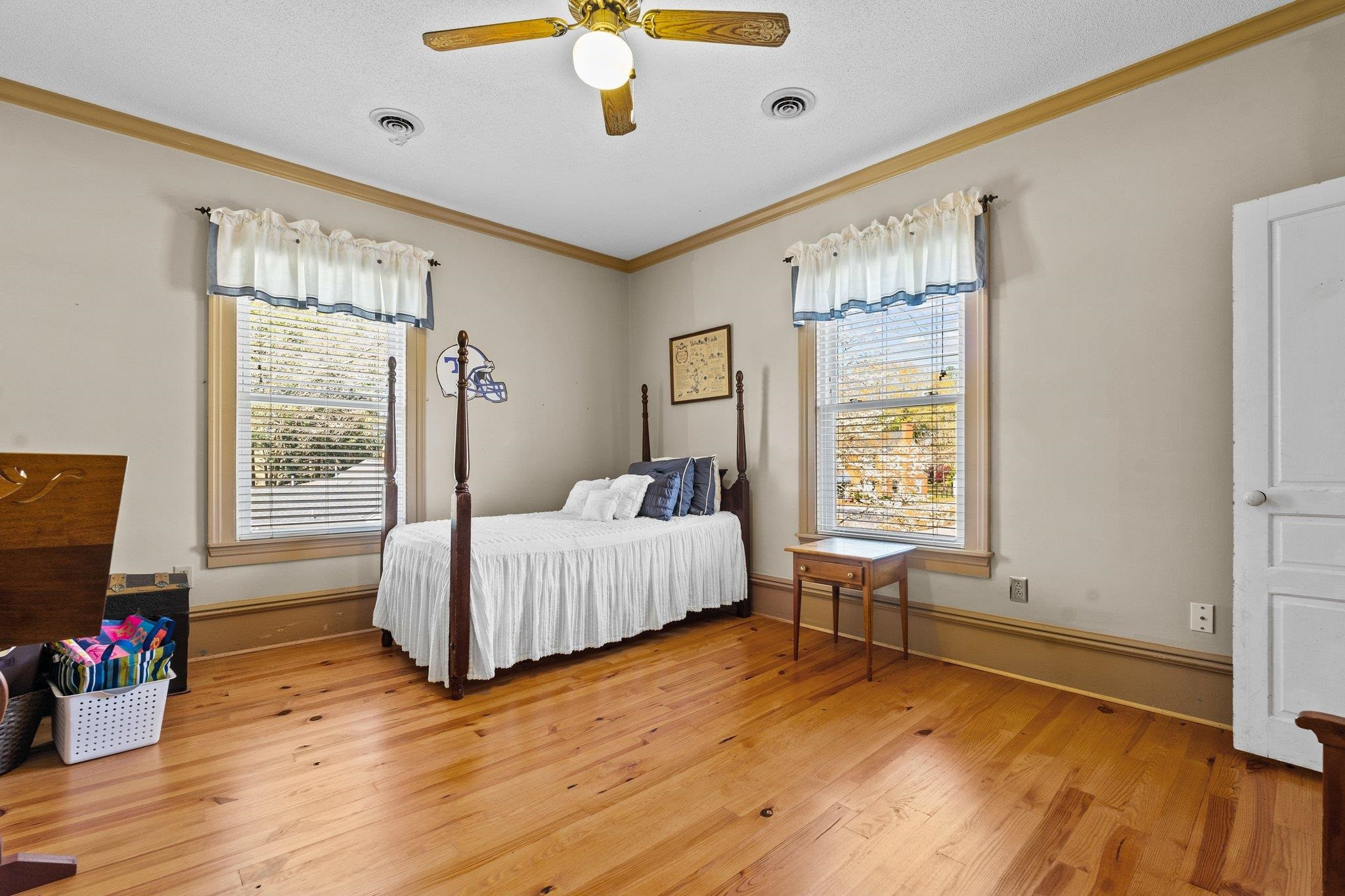 407 Old Post Road Erwin, NC 28339 - Photo 27 of 44 a bedroom with a bed and wooden floor