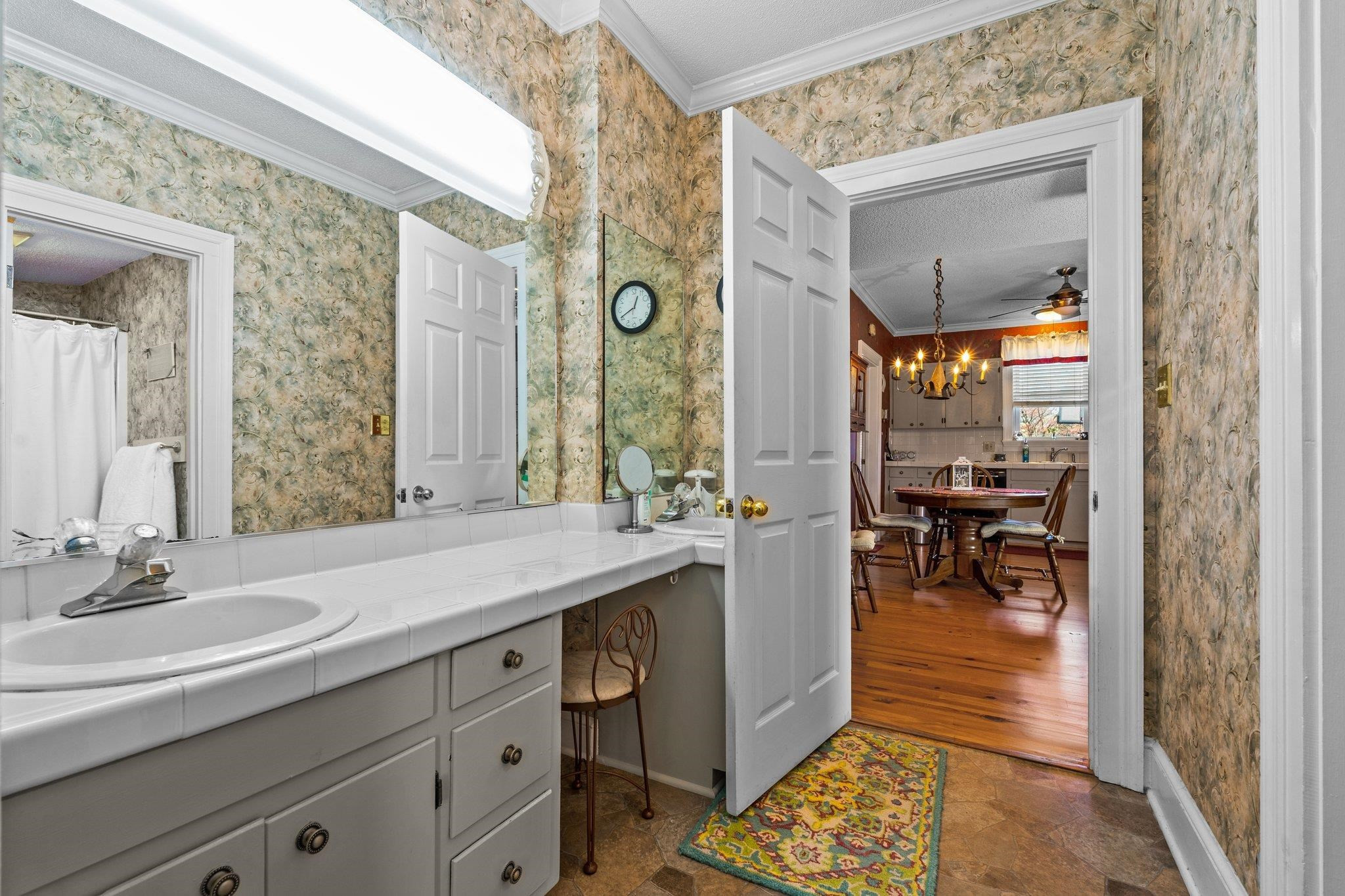 407 Old Post Road Erwin, NC 28339 - Photo 28 of 44 a bathroom with a sink a mirror and a shower