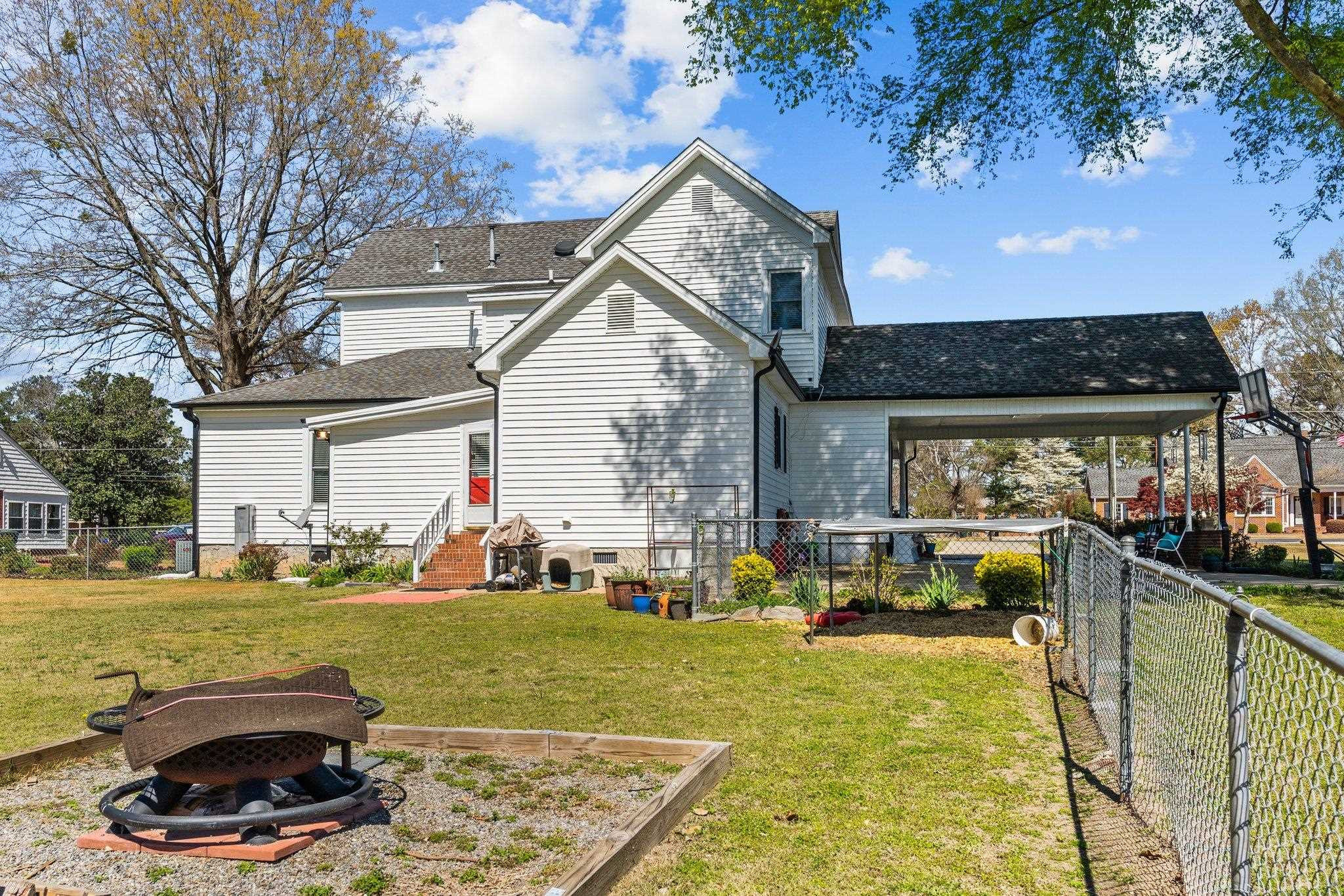 407 Old Post Road Erwin, NC 28339 - Photo 30 of 44 a view of a house with swimming pool and sitting area