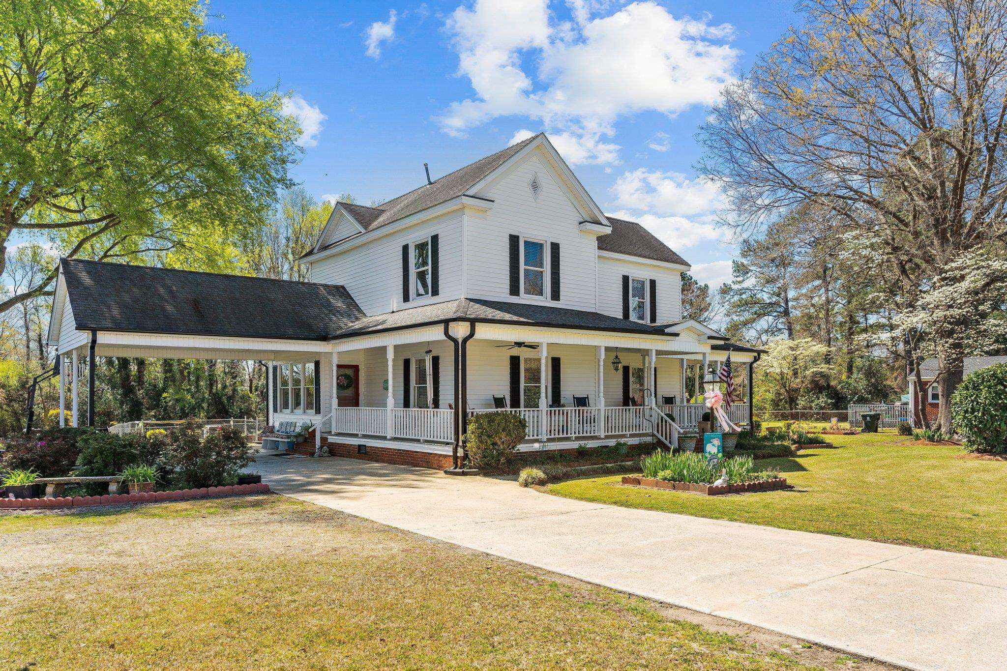 407 Old Post Road Erwin, NC 28339 - Photo 3 of 44 a front view of a house with a yard