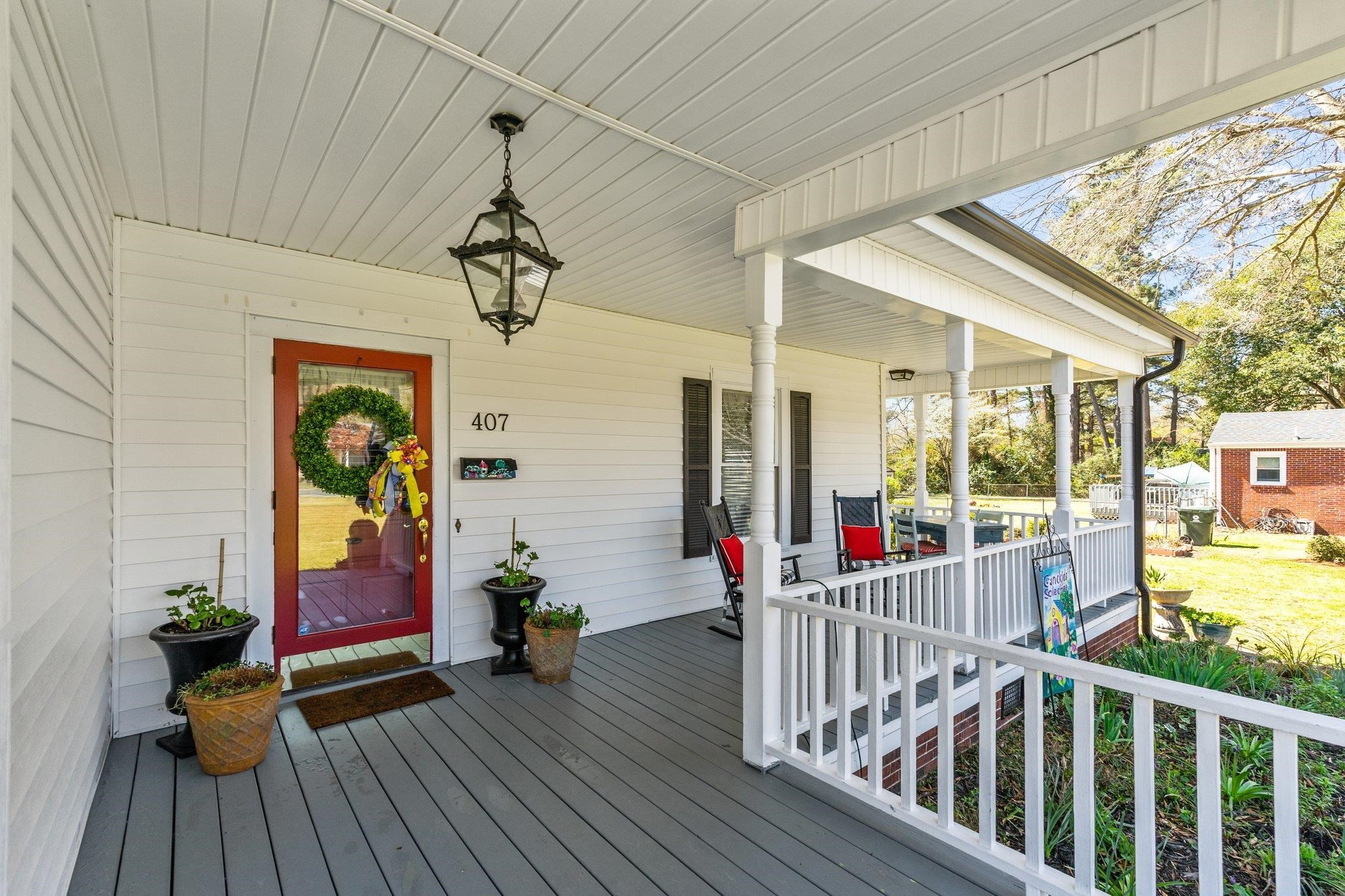 407 Old Post Road Erwin, NC 28339 - Photo 31 of 44 a view of a balcony with wooden floor