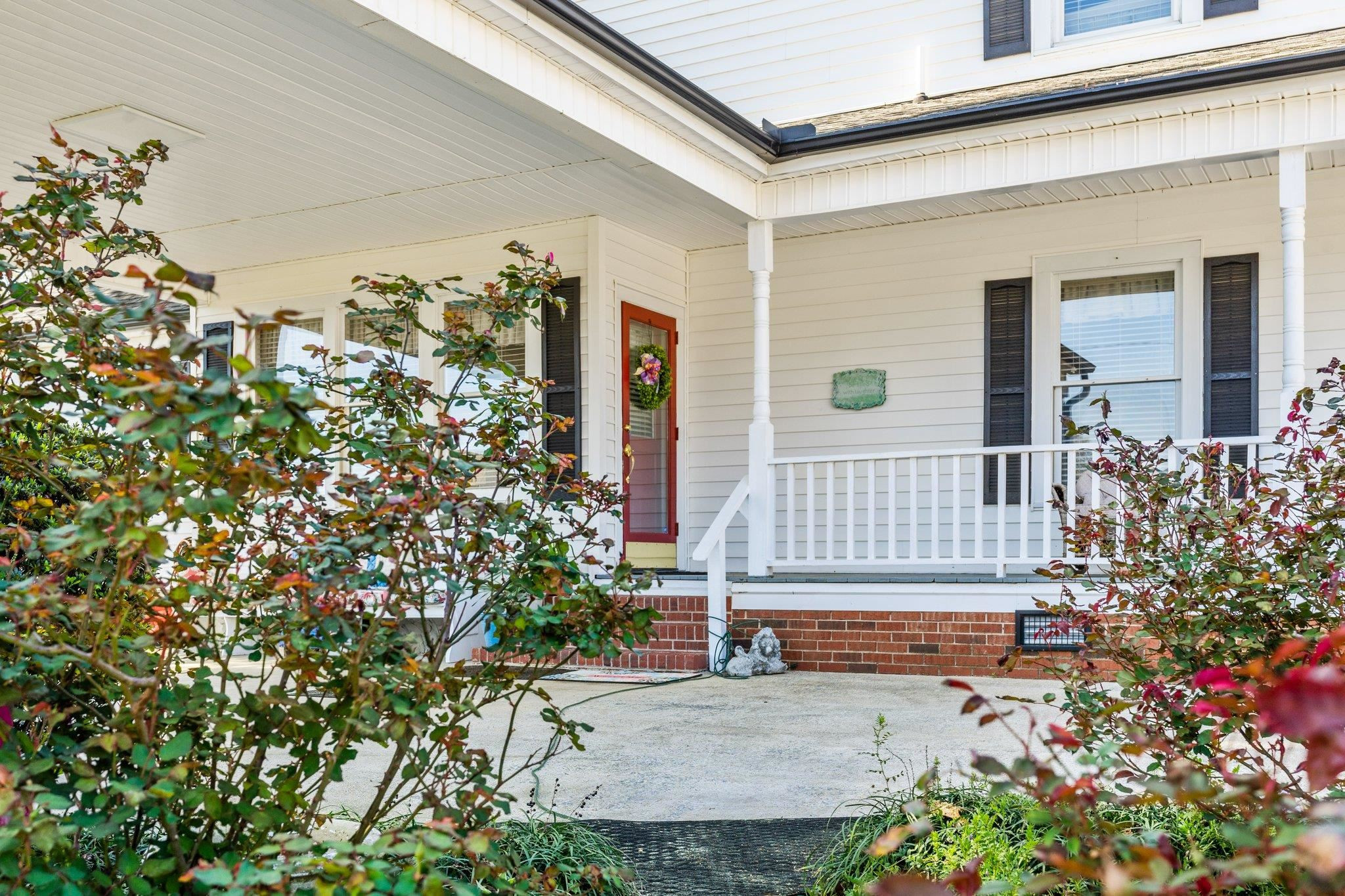 407 Old Post Road Erwin, NC 28339 - Photo 32 of 44 front view of a house with a small yard