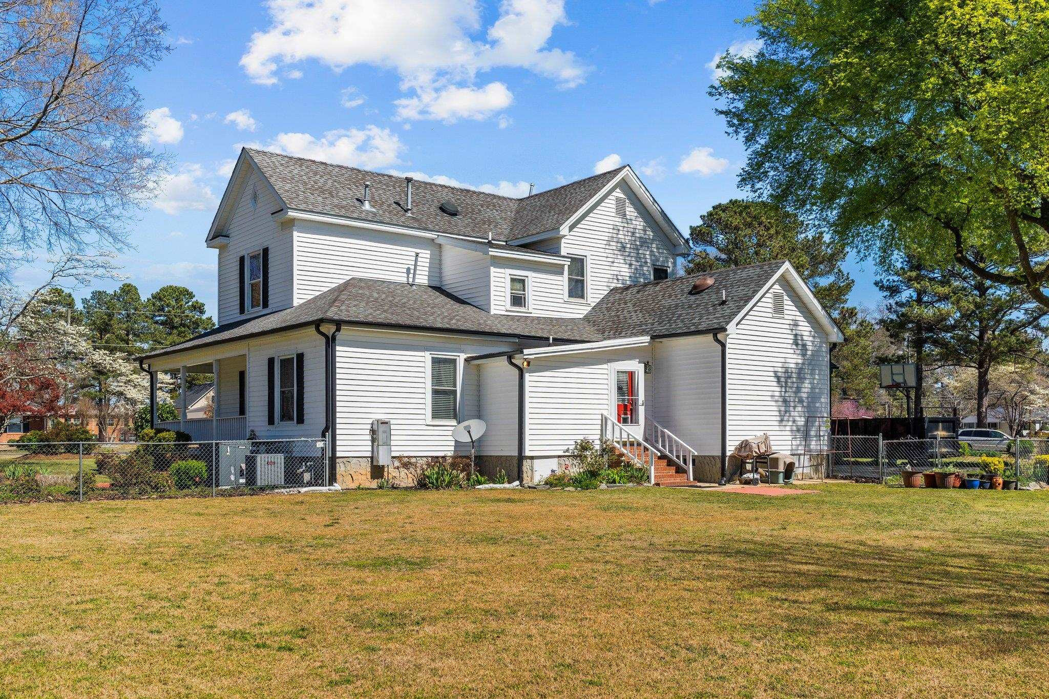 407 Old Post Road Erwin, NC 28339 - Photo 34 of 44 a front view of a house with swimming pool and sitting area