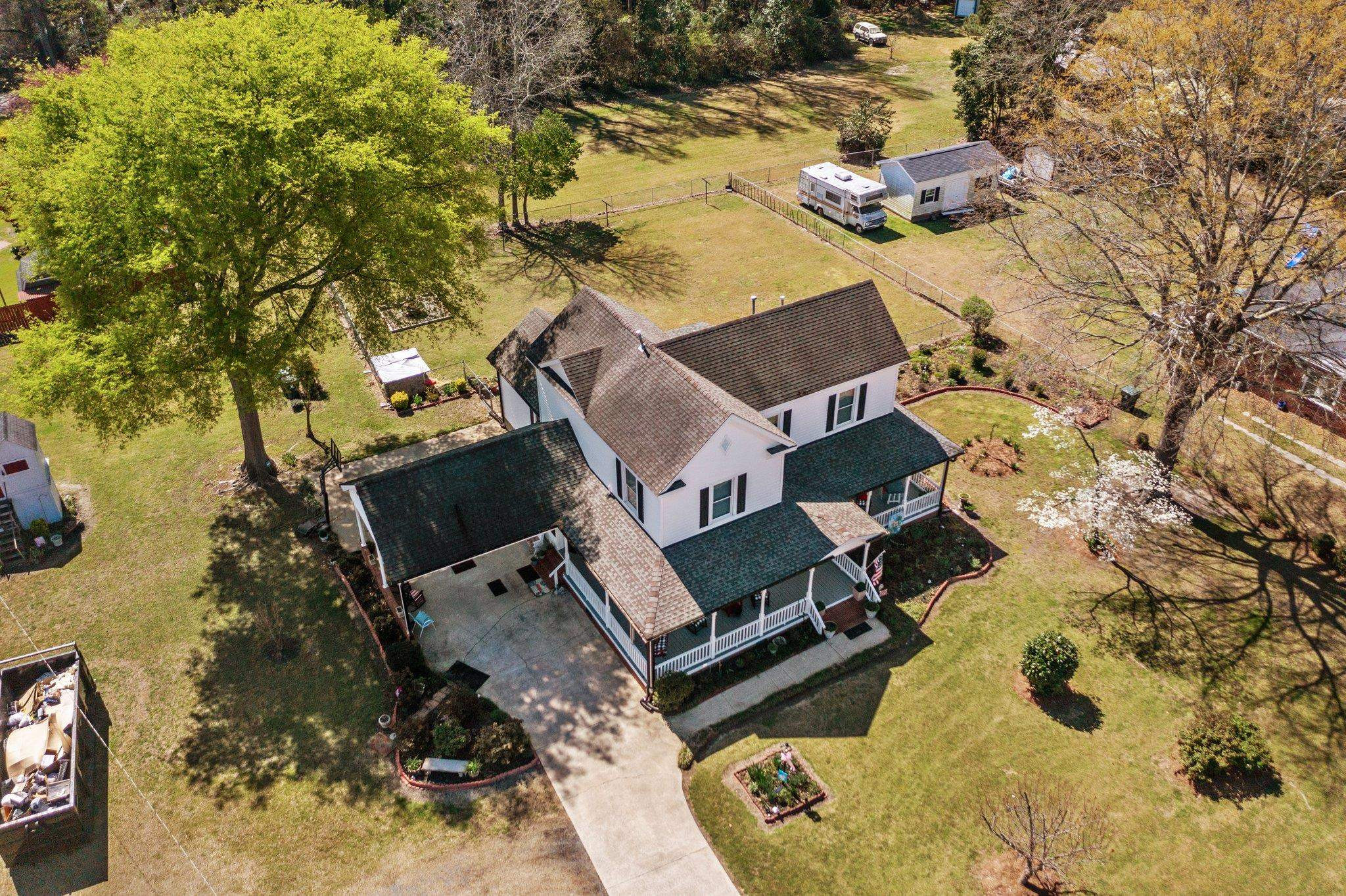 407 Old Post Road Erwin, NC 28339 - Photo 41 of 44 an aerial view of a house with a yard and lake view