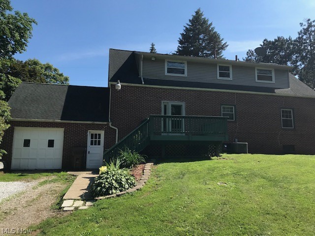 1283 Center Road Clinton, OH 44216 - Photo 2 of 33 EXTERIOR BACK OF HOUSE - DECK AND 1 CAR ATT GARAGE