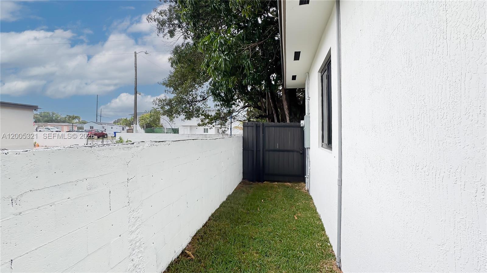 4517 Northwest 3rd Street, Unit 4517 Miami, FL 33126 - Photo 4 of 12 a view of balcony with a garden