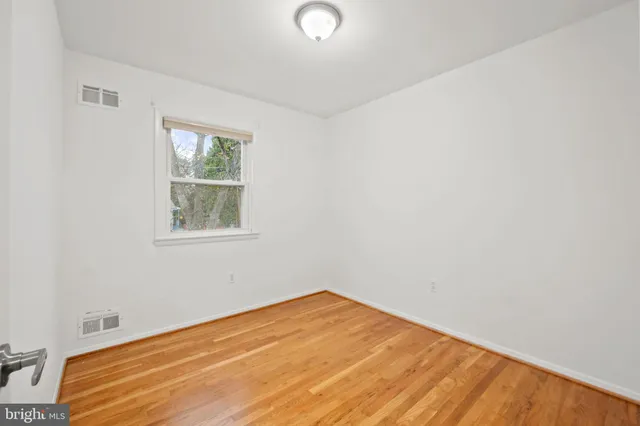 a room with a bed and a window