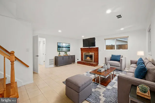 a living room with furniture or couch and a flat screen tv