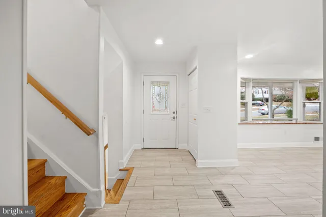a view of an entryway with wooden floor