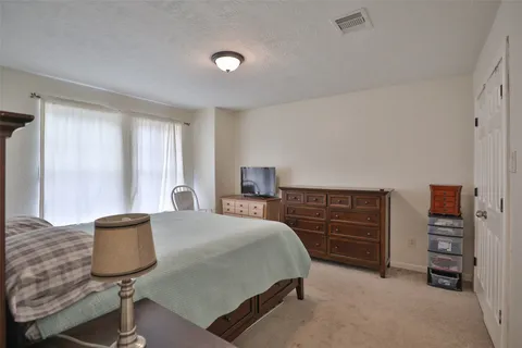 a bedroom with a bed and furniture