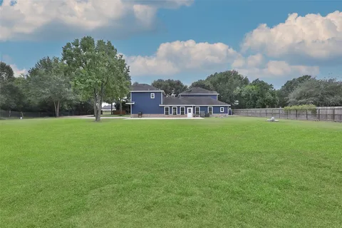 a view of a house with a big yard